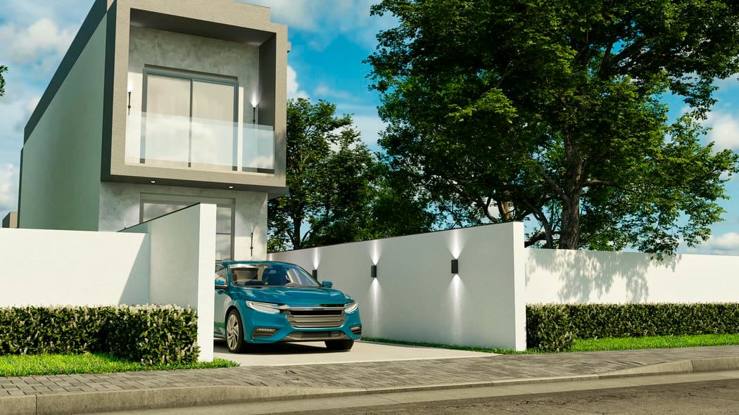 Fachada frontal de sobrado com garagem coberta