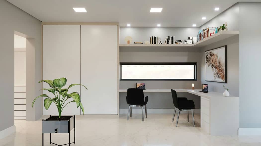 Cozinha moderna com design minimalista. Há uma ilha de cozinha em primeiro plano com dois bancos altos, e atrás dela, há armários embutidos e prateleiras ao longo da parede.