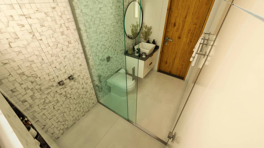 Banheiro moderno com box de vidro, revestimento em tons claros e piso de porcelanato.